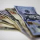 Dólar despenca, bate R$ 5,73, e renova mínima do dia